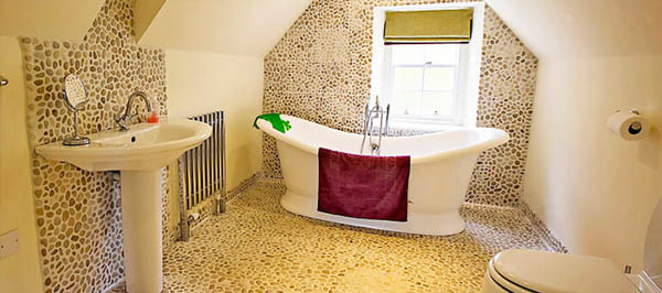 Large luxury bathroom with roll top bath