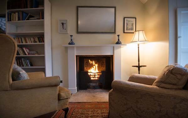 large sitting room with open fire