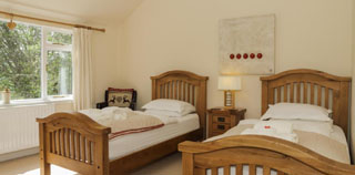 twin bedroom with oak beds