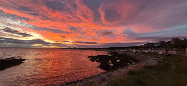 the sea and beach at sunset